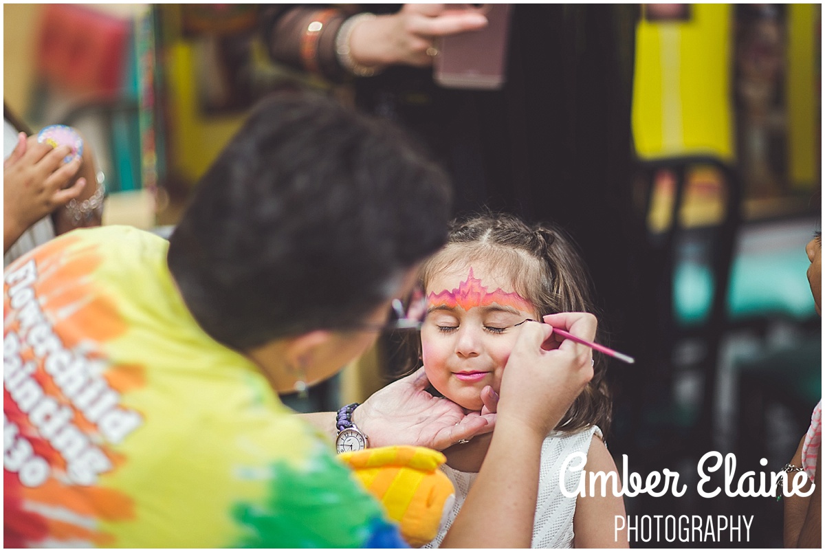 lifestyle birthday photography for girl toddler with face painting and games