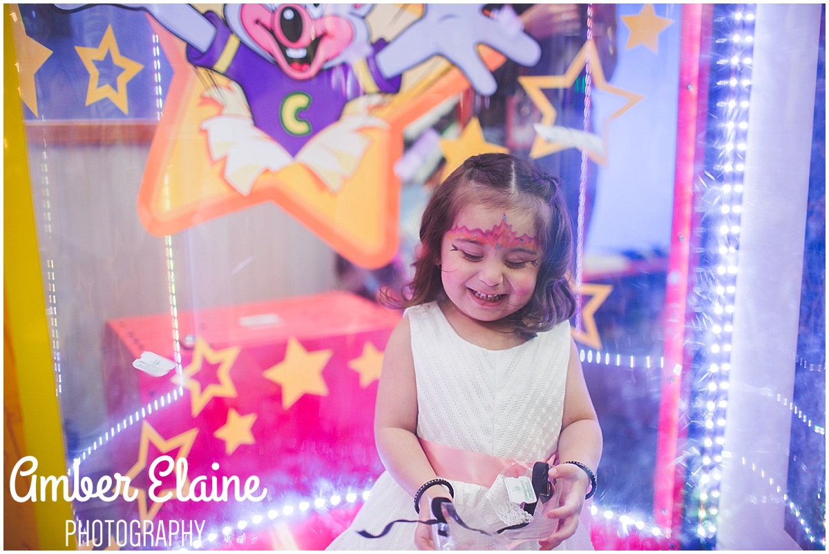 lifestyle birthday photography for girl toddler with face painting and games