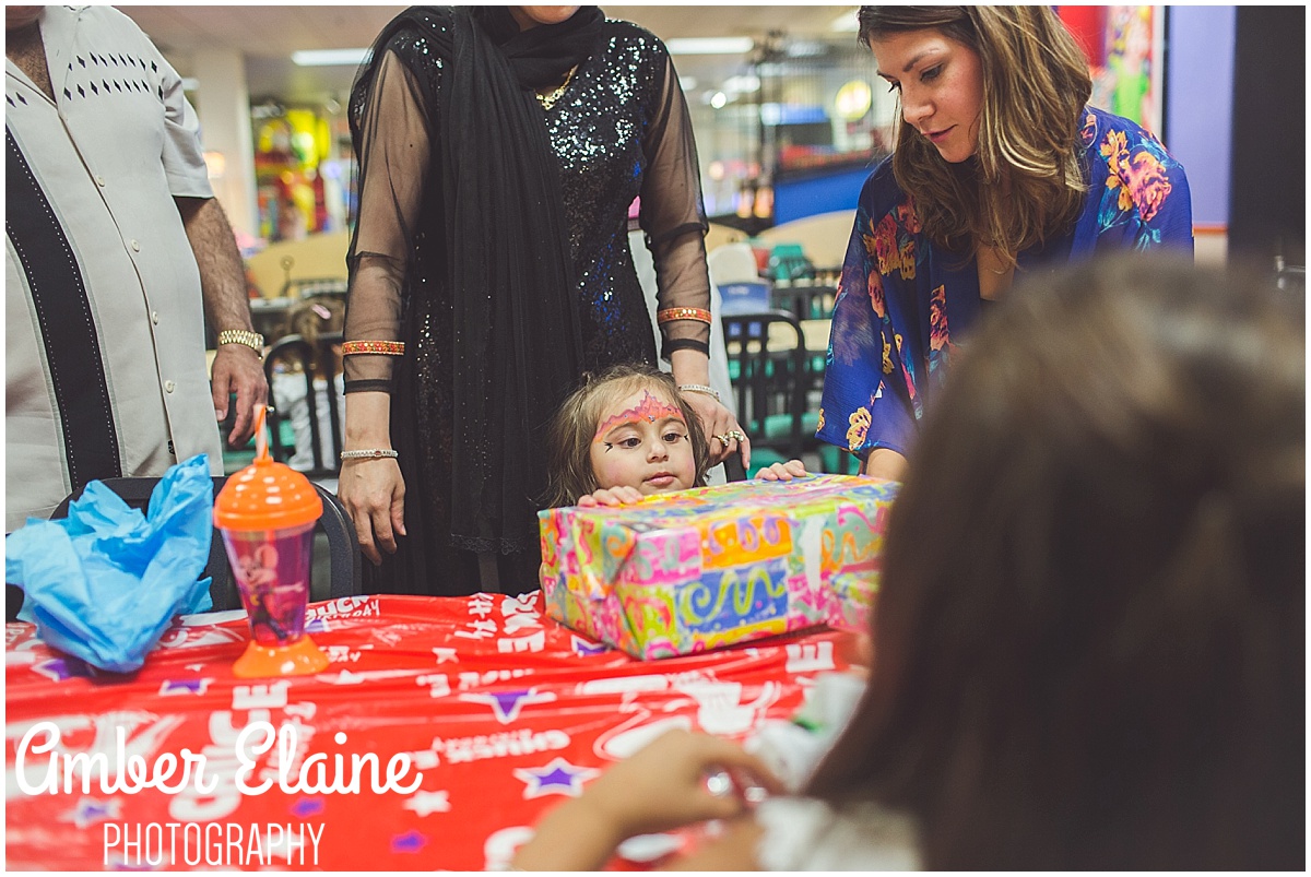 lifestyle birthday photography for girl toddler with face painting and games